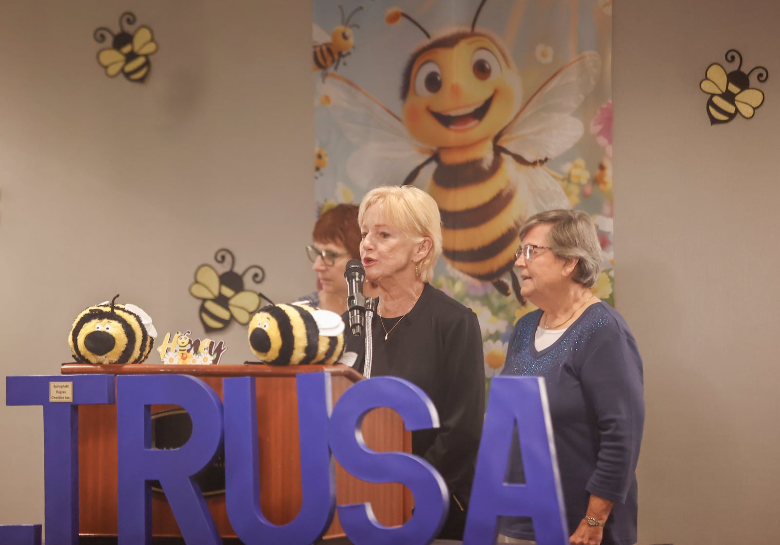 Mary Manoloff, center, of "Not So Young Women," spells a word next to LeeAnn Ellsworth, left, and Margie Bartley, during Altrusa's 26th annual Literacy Sting on Monday, September 22, 2025, at Springfield Courtyard by Marriott. Their team finished in second place. JOSEPH COOKE/STAFF