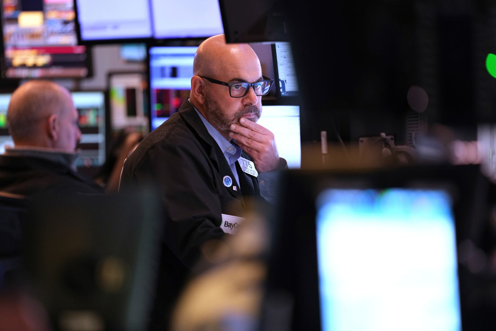 Federico DeMarco works on the floor at the New York Stock Exchange in New York, Monday, April 7, 2025. (AP Photo/Seth Wenig)