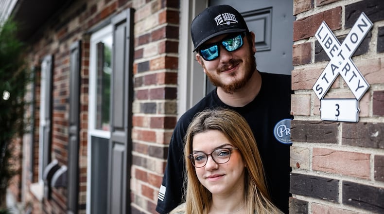 Elizabeth Palmer and Lane Prunty are moving from an apartment in Carlisle to a home in New Lebanon. JIM NOELKER/STAFF