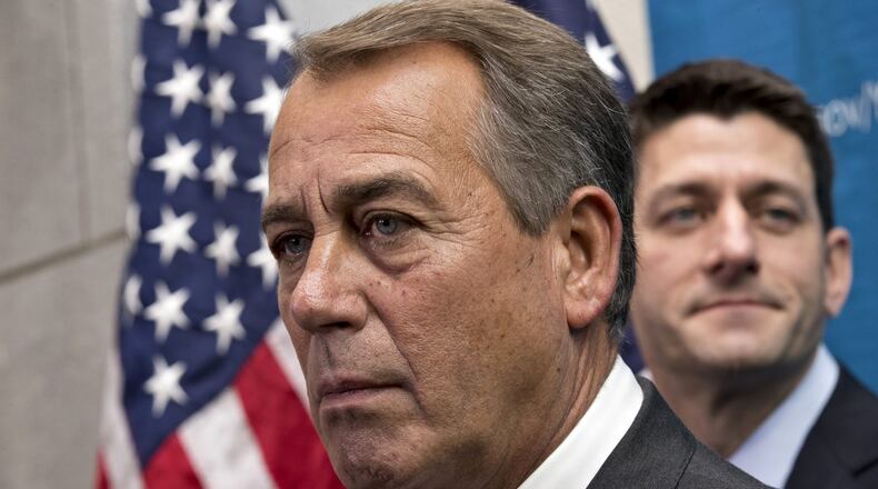 House Speaker John Boehner of Ohio, left, joined by House Budget Committee Chairman Rep. Paul Ryan, R-Wis., takes reporters’ questions, on Capitol Hill in Washington, Wednesday, Dec. 11, 2013, as House Republicans signaled support for a budget deal worked out yesterday between Ryan and Senate Budget Committee Chair Rep. Patty Murray, D-Wash. The budget deal was one of a few major measures left on Congress’ to-do list near the end of a bruising year that has produced a partial government shutdown, a flirtation with a first-ever federal default and gridlock on President Obama’s agenda. (AP Photo/J. Scott Applewhite)