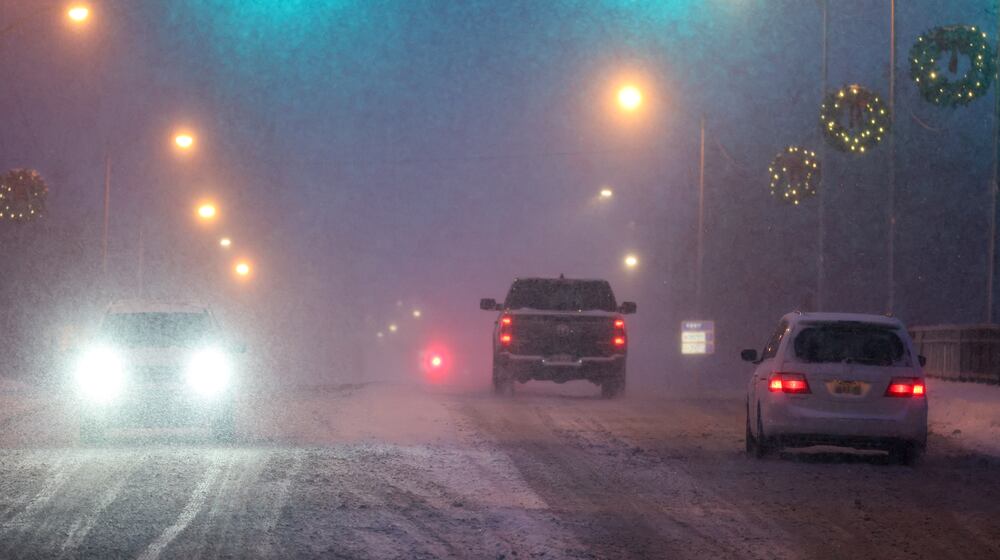 Vehicles drive on North Market Street in Troy on Dec. 13. Troy received over five inches of snow that day. BRYANT BILLING/STAFF