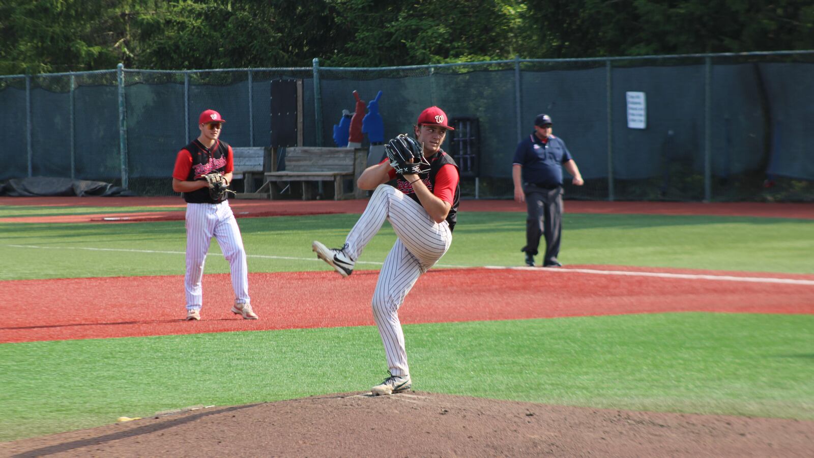 Lakota West senior pitcher Tucker Wilburn winds up during the Firebirds' 1-0 regional semifinal win over Olentangy Liberty at Nischwitz Stadium on Tuesday. JACOB BENGE