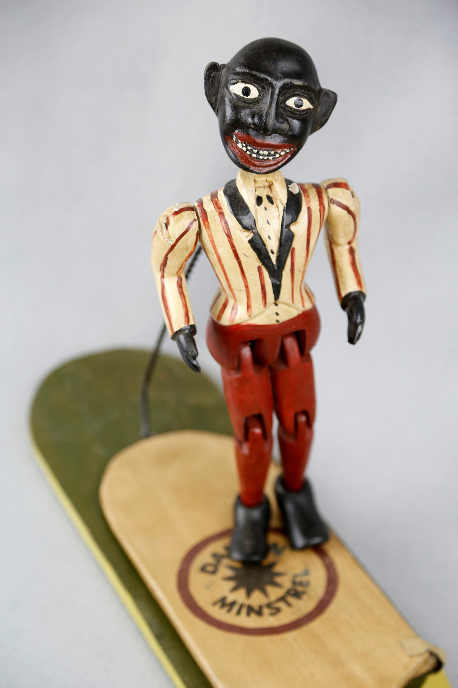 A "Jig Doll" is part of the National Afro-American Museum & Cultural Center in Wilberforce. The toy was mass produced in the mid-twentieth century with a body made of painted wood. A spring attached the puppet makes him "dance" when the paddle is tapped. LISA POWELL / STAFF