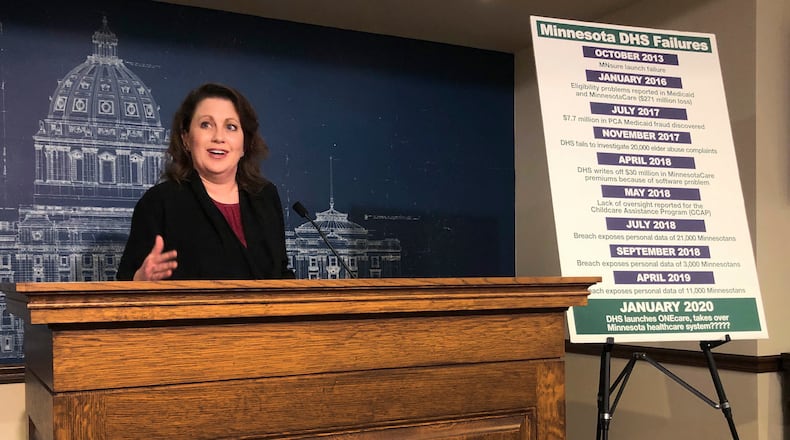 FILE - State Sen. Michelle Benson reacts at a news conference on Wednesday, April 10, 2019 at the Minnesota State Capitol in St. Paul to a report by the state's legislative auditor on combatting fraud in Minnesota's Child Care Assistance Program. (AP Photo/Steve Karnowski,File)