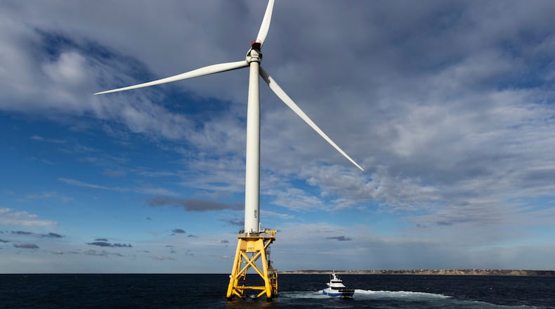 FILE - A Block Island Wind Farm turbine operates, Dec. 7, 2023, off the coast of Block Island, R.I., during a tour organized by Orsted. (AP Photo/Julia Nikhinson, File)