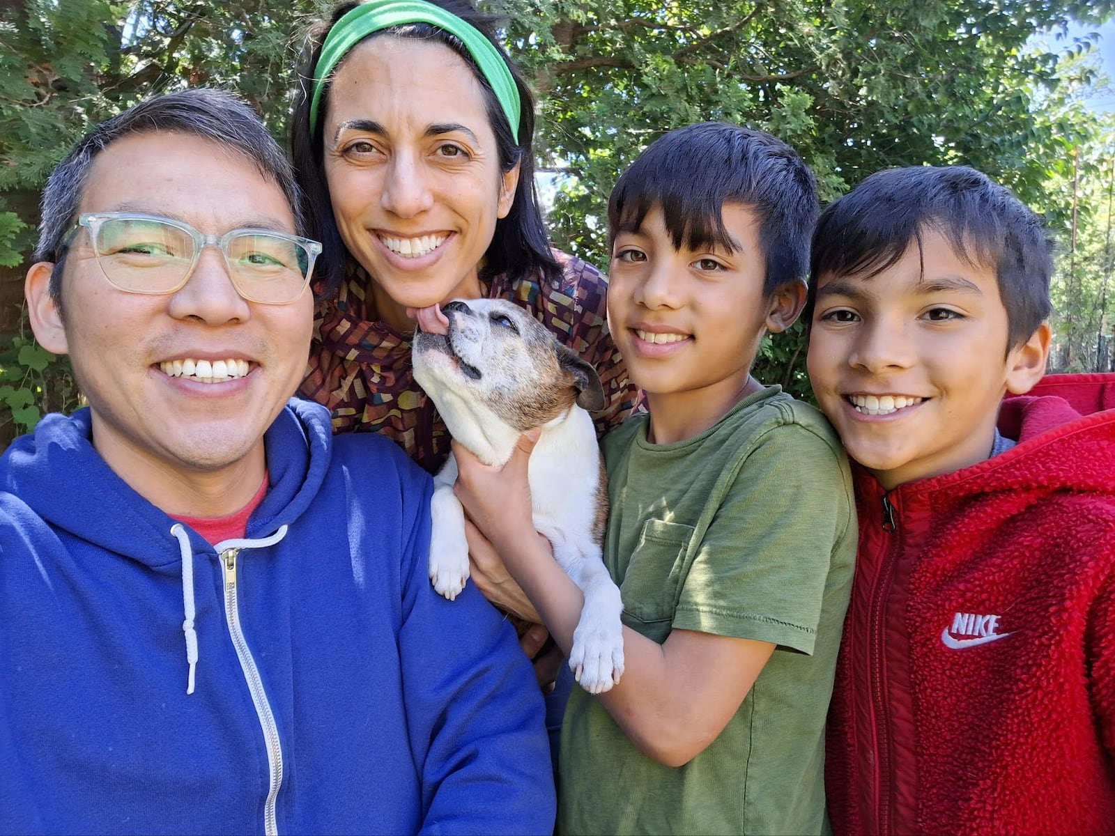 John Kim (left), who went alongside Tom Archdeacon to Paris for the signing of the Dayton Peace Accords, with his family (from left): wife Sarah, dog Rosie and twin sons Jonah and Levi. CONTRIBUTED