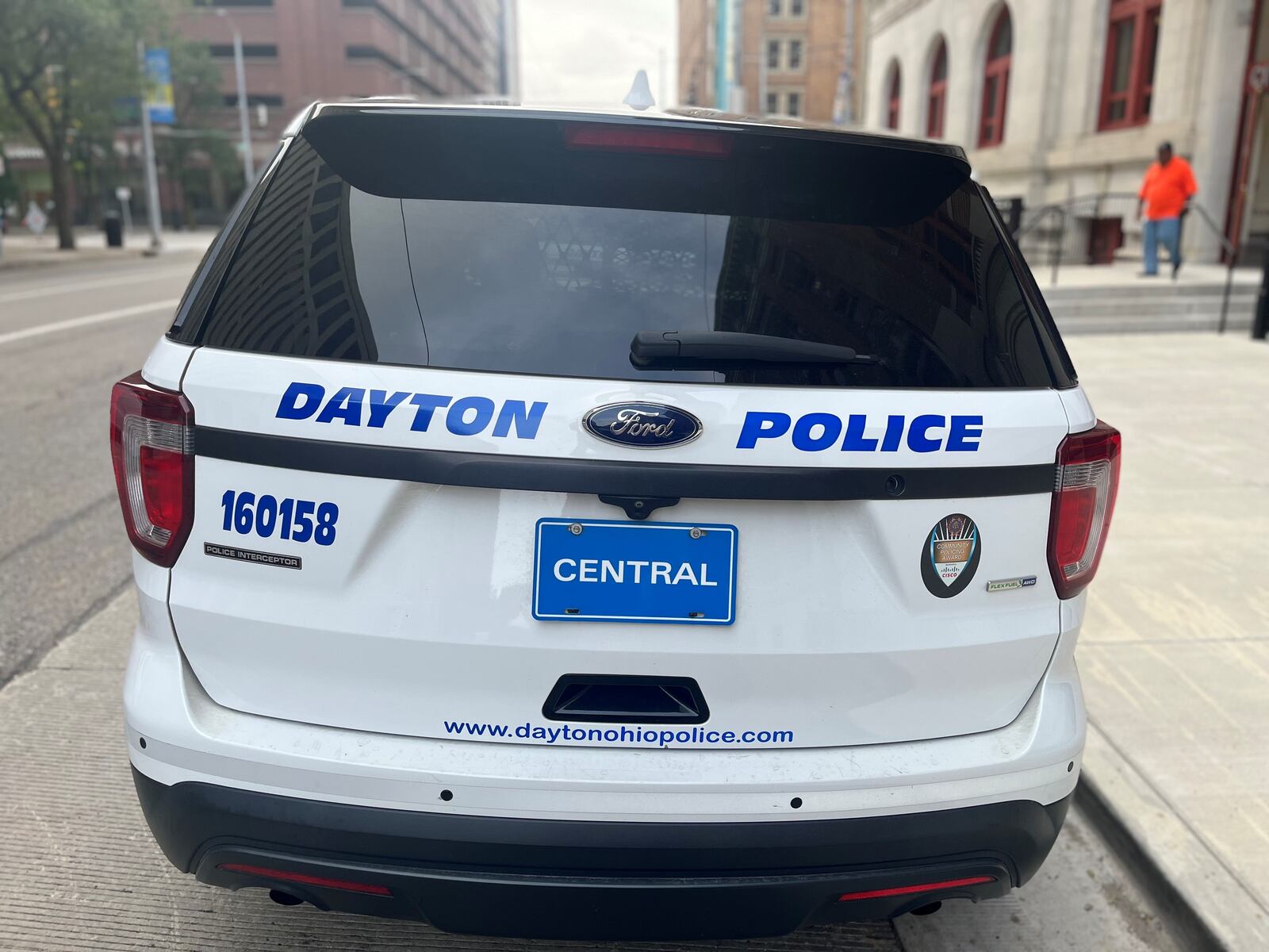 A Dayton Police Department cruiser parked outside of City Hall. CORNELIUS FROLIK / STAFF