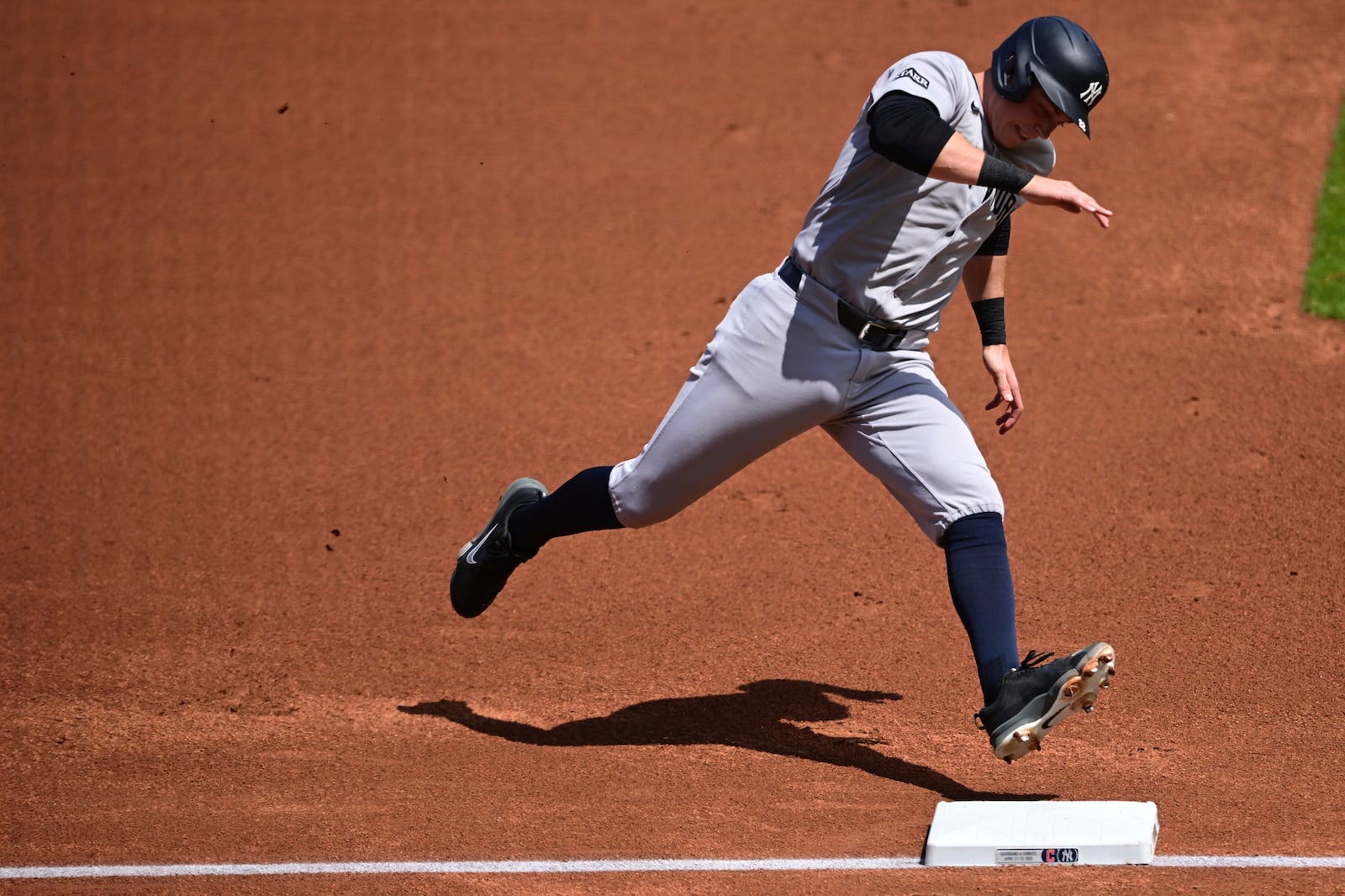 New York Yankees' Ben Rice runs home to score a run on an RBI triple by Aaron Judge during the first inning of a baseball game against the Cleveland Guardians Wednesday, April 23, 2025, in Cleveland. (AP Photo/David Dermer)