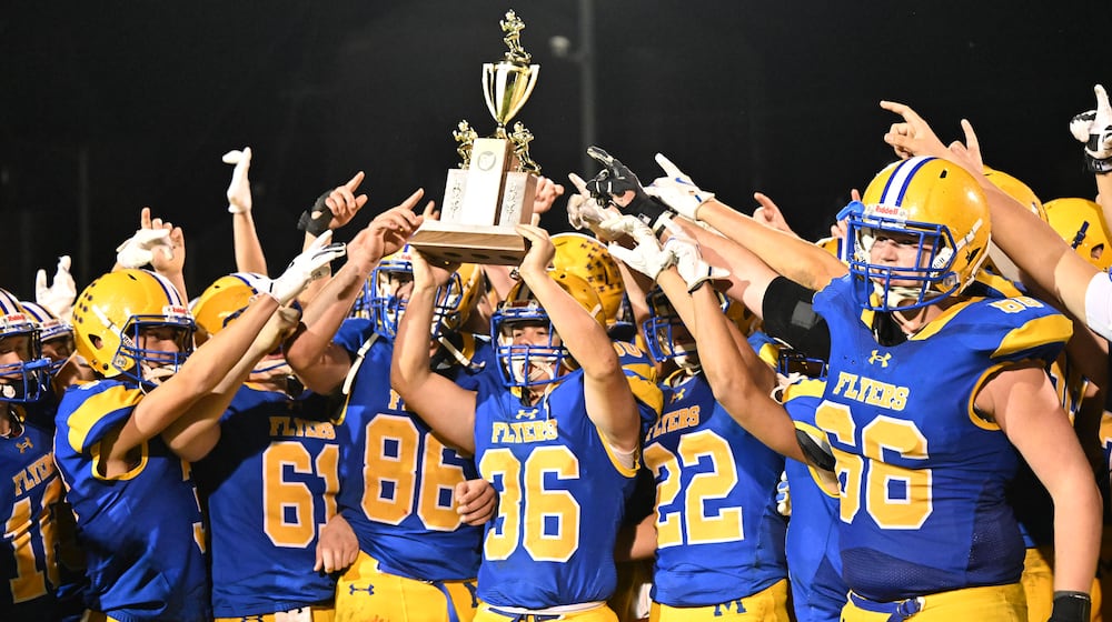 Marion Local junior Andrew Schmackers runs during a 98-yard kickoff return for a touchdown late in the third quarter of a 7-6 win over Coldwater in a Midwest Athletic Conference game on Friday, Oct. 24 at Booster Stadium in Maria Stein. BRYANT BILLING / STAFF