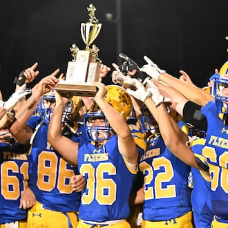Marion Local junior Andrew Schmackers runs during a 98-yard kickoff return for a touchdown late in the third quarter of a 7-6 win over Coldwater in a Midwest Athletic Conference game on Friday, Oct. 24 at Booster Stadium in Maria Stein. BRYANT BILLING / STAFF