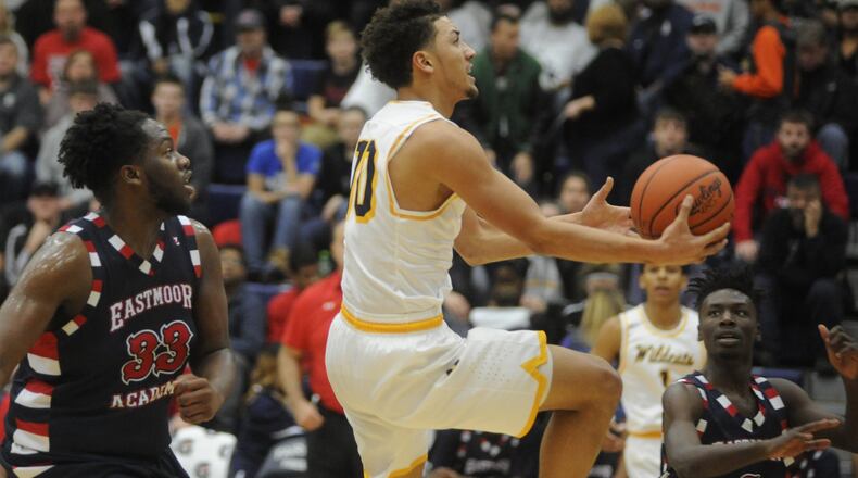 Springfield’s Danny Davis (shooting) is among the GWOC scoring leaders at 19.2 points per game. MARC PENDLETON / STAFF