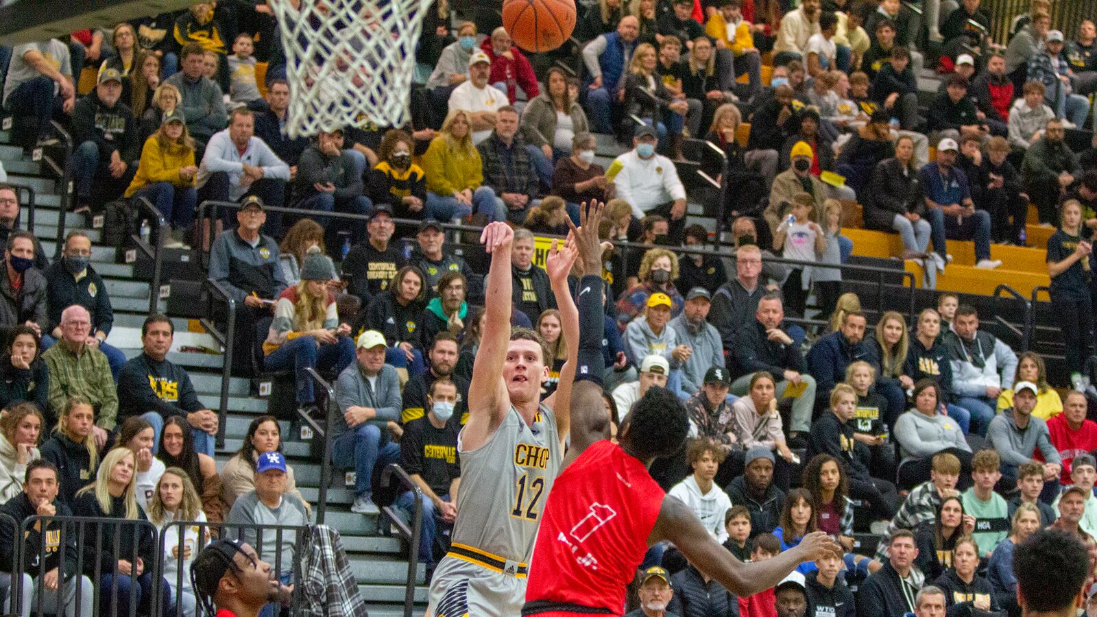 Centerville's Tom House shoots over Flyght Academy's Will Hill during the Elks' 74-56 victory over Flyght Academy on Sunday at Centerville. House made five 3-pointers and scored 19 points. Jeff Gilbert/CONTRIBUTED