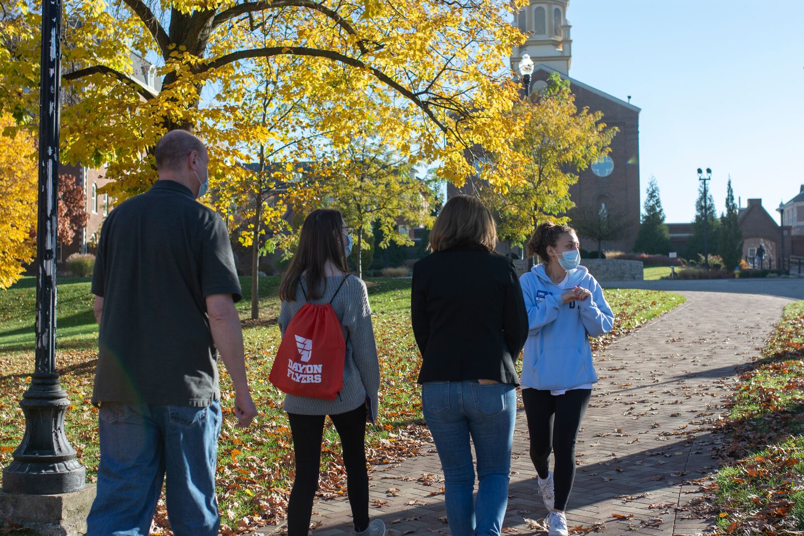 A UD student leads a prospective family on a campus tour. CONTRIBUTED