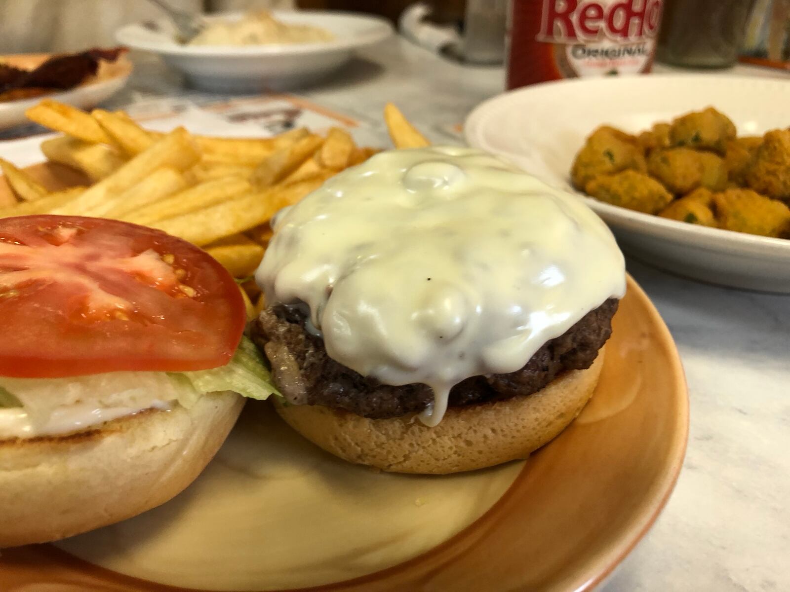 Grips Grill and Diner is located at  15 Springfield St. in Dayton. The Big Gripper - stuffed burger with mushrooms, green peppers, onions, bacon and jalapeno peppers  and cheese - is picture with an order of fries.