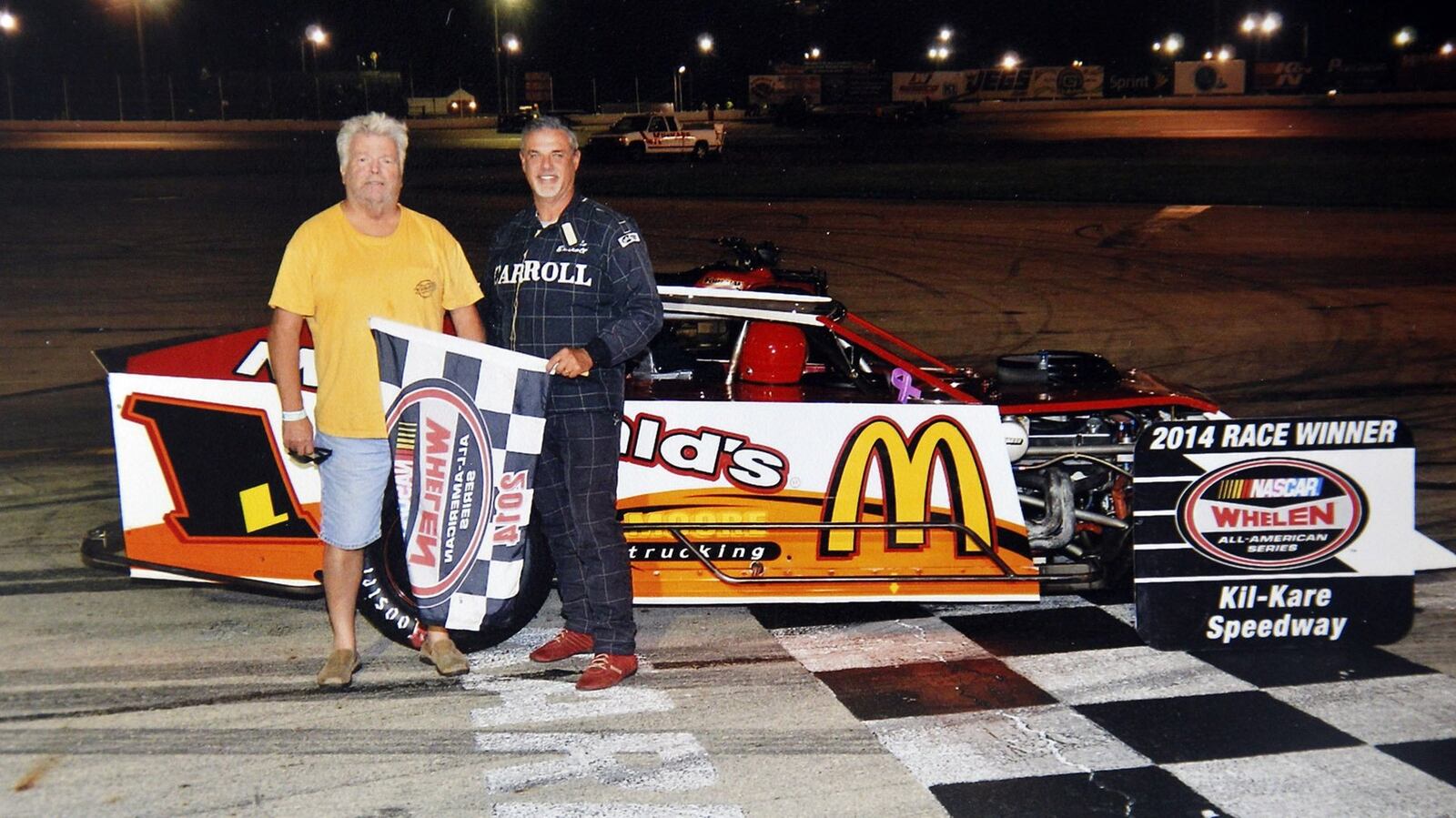 John Goins with driver Mike Carroll at Kill Kare in 2014. Marvin Goins is finishing the restoration of a Ray Smith sprint car that he started with his late brother John “Pee Wee” Goins in Miamisburg. SUBMITTED