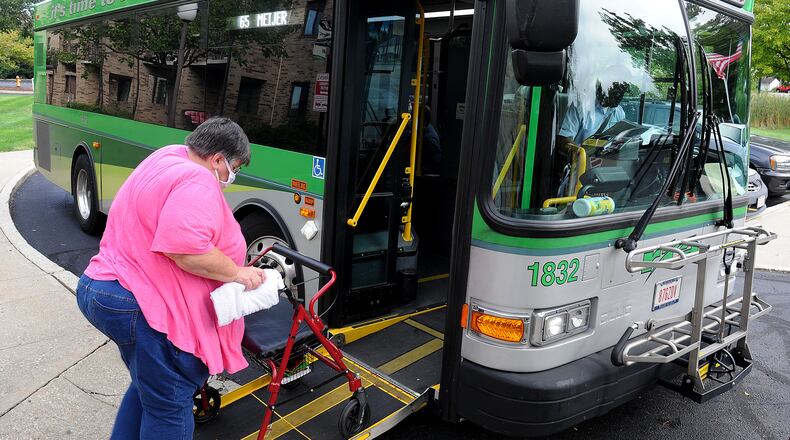 Disabled veteran Candance Woods uses a Senior EZ Ride route to shop on Tuesdays and Thursdays. Beginning Oct. 3, the Greater Dayton Regional Transit Authority is cutting her route and two others, calling the change temporary due to a shortage of drivers. MARSHALL GORBY / STAFF