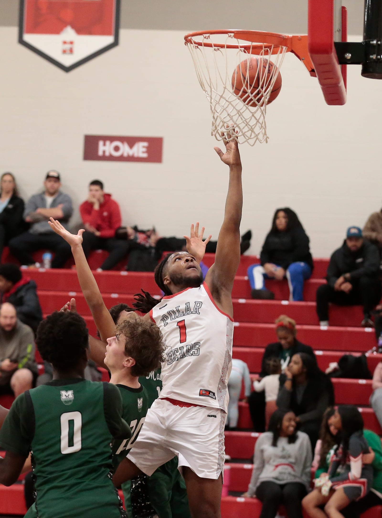Northridge senior Deonte Smith scores two of his 13 points as his team defeated Mason 52-43 in a non-league game Tuesday, Dec. 22, 2025, in Dayton. STEVEN WRIGHT / STAFF
