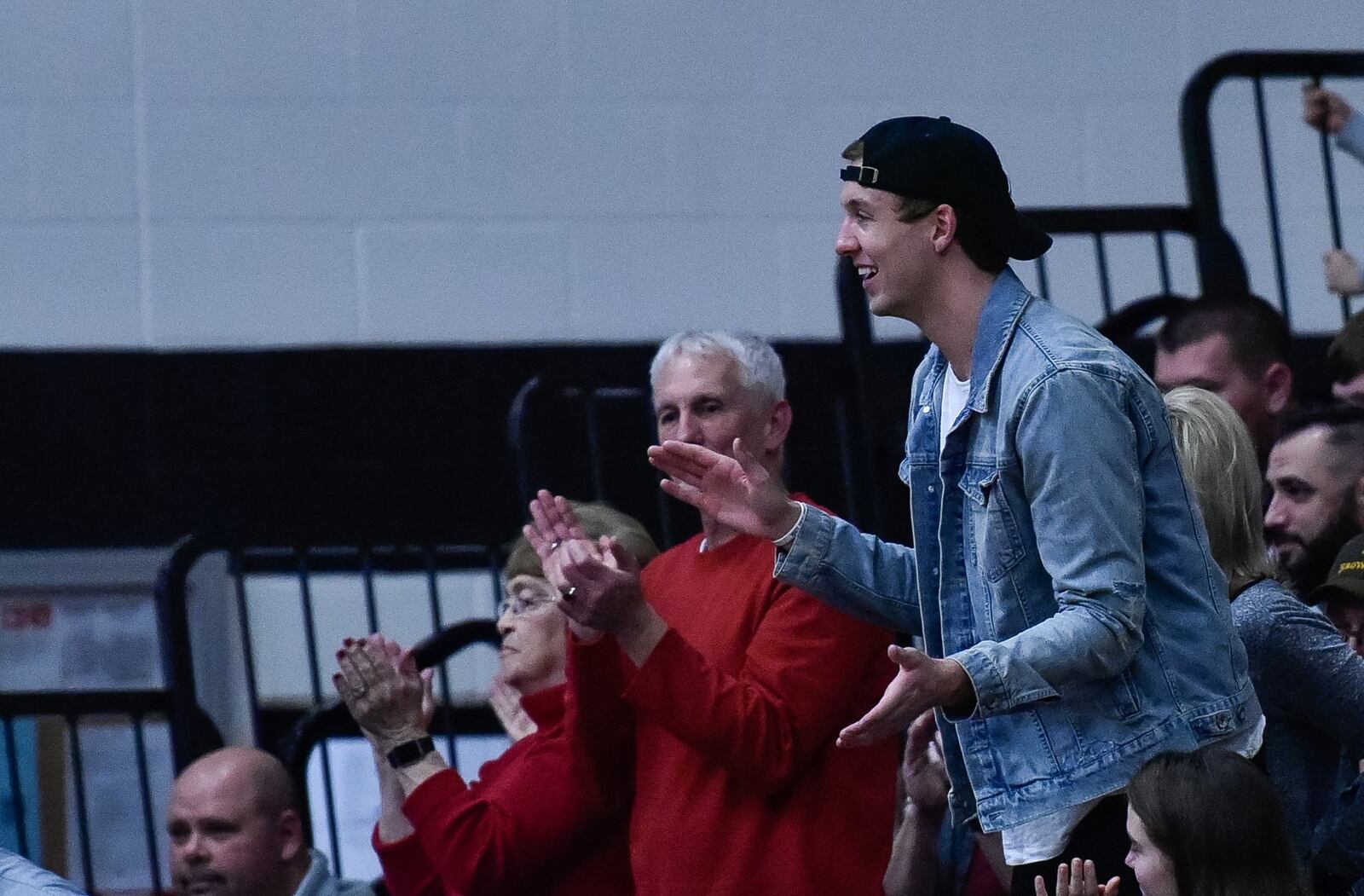 Former Franklin basketball player Luke Kennard cheers on his old school during Friday night’s game against Valley View at Darrell Hedric Gym in Franklin. Kennard, now with the NBA’s Detroit Pistons, watched the Wildcats win 61-42 to clinch a share of their seventh straight Southwestern Buckeye League Southwestern Division championship. NICK GRAHAM/STAFF