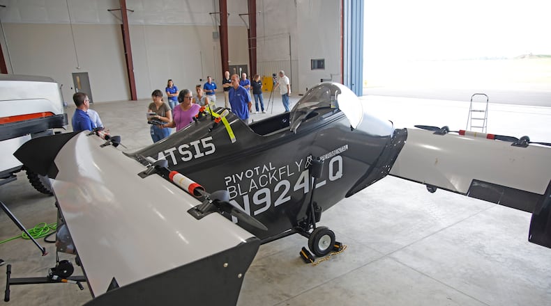 Josh Lane, flight test engineer and site manager, talks about the PIVOTAL Blackfly electric verticle takeoff and landing aircraft Monday, June 17, 2024 at the National Advanced Air Mobility Center of Excellence at Springfield-Beckley Municipal Airport. BILL LACKEY/STAFF