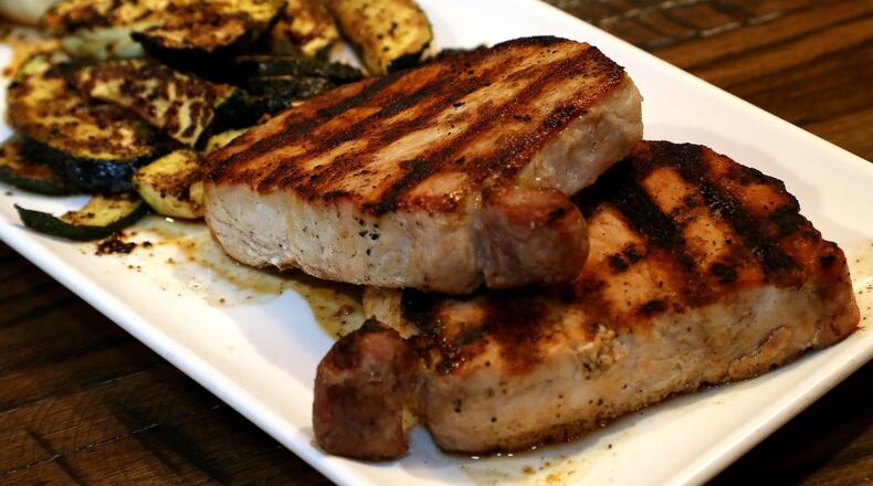 The “Chop Chop” pork chops at MIXX 165. BILL LACKEY/STAFF