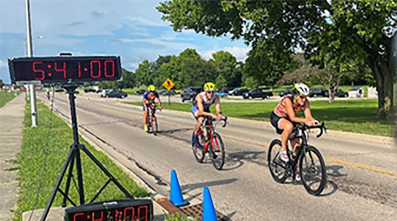 Three riders cross the finish line Aug. 9 on Wright-Patterson Air Force Base. They were among 175 competitors in the August Blue Streak Time Trial. U.S. AIR FORCE PHOTO/AIRMAN 1ST CLASS JAMES JOHNSON