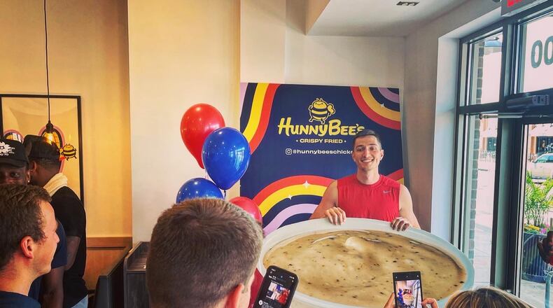 Ryan Mikesell, of the Red Scare, poses for a photo at Hunny Bee's Crispy Fried in Dayton on Thursday, July 21, 2022. David Jablonski/Staff