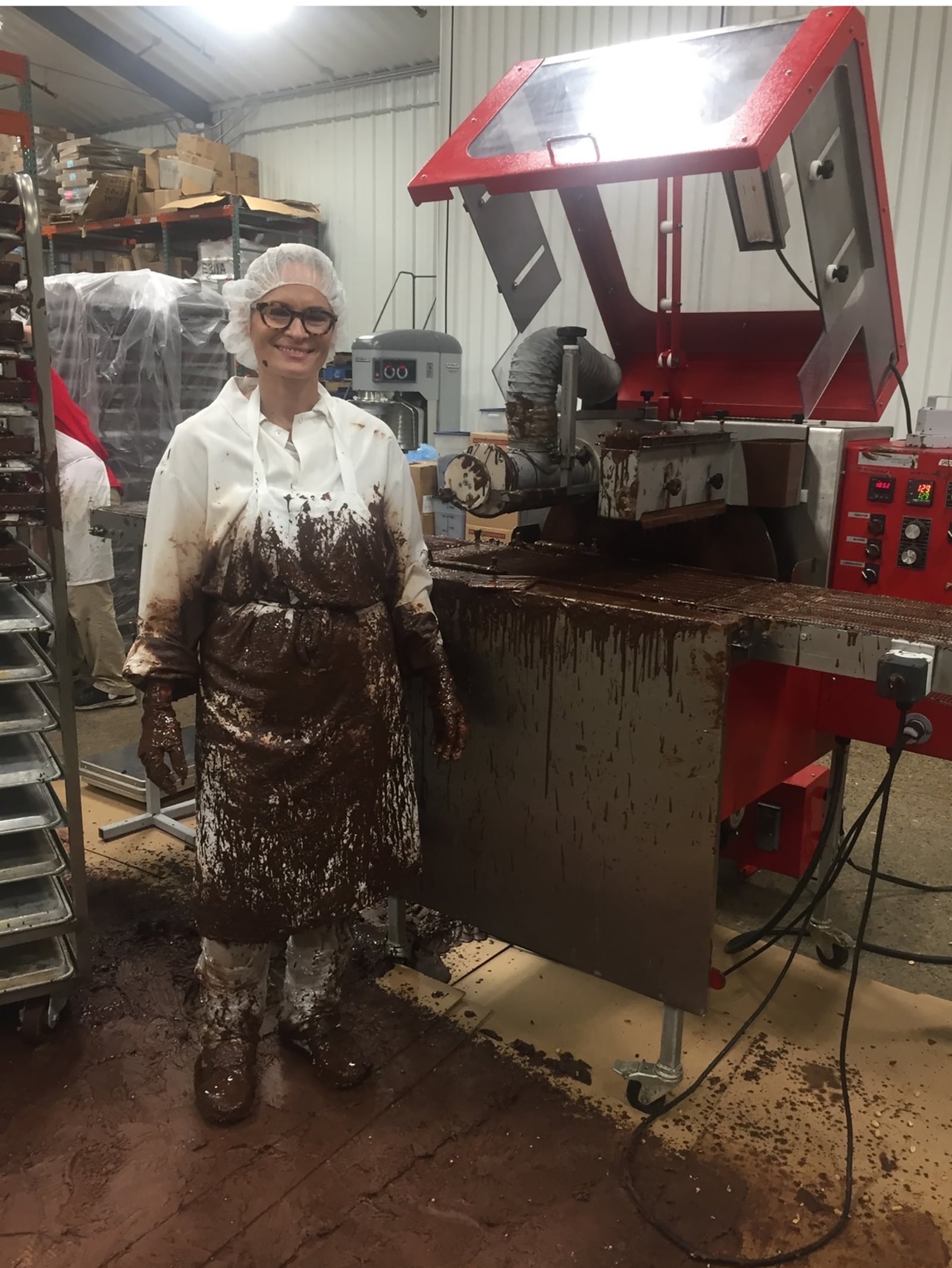 Ross has spent many hours at the Killer Brownie manufacturing facility in Miamisburg "covered in chocolate." Early efforts with a chocolate enrober that we too small for the tasks resulted in many overflows.