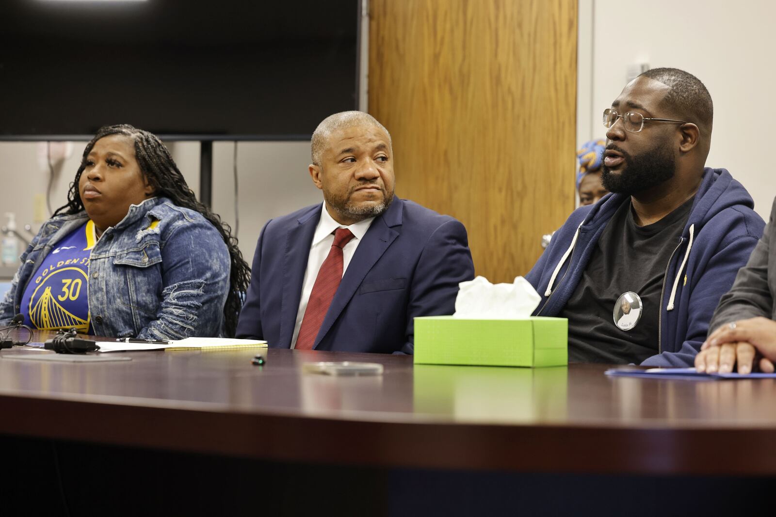 Nellie Bailey, left, mother of Alfred Hale III, attorney Michael Wright, middle, and Alfred Hale II, the father of Alfred Hale III, an 18-year-old Dunbar High School student who was killed on his way to school April 4, speak to media about his death Tuesday, May 20, 2025 in Dayton. NICK GRAHAM/STAFF