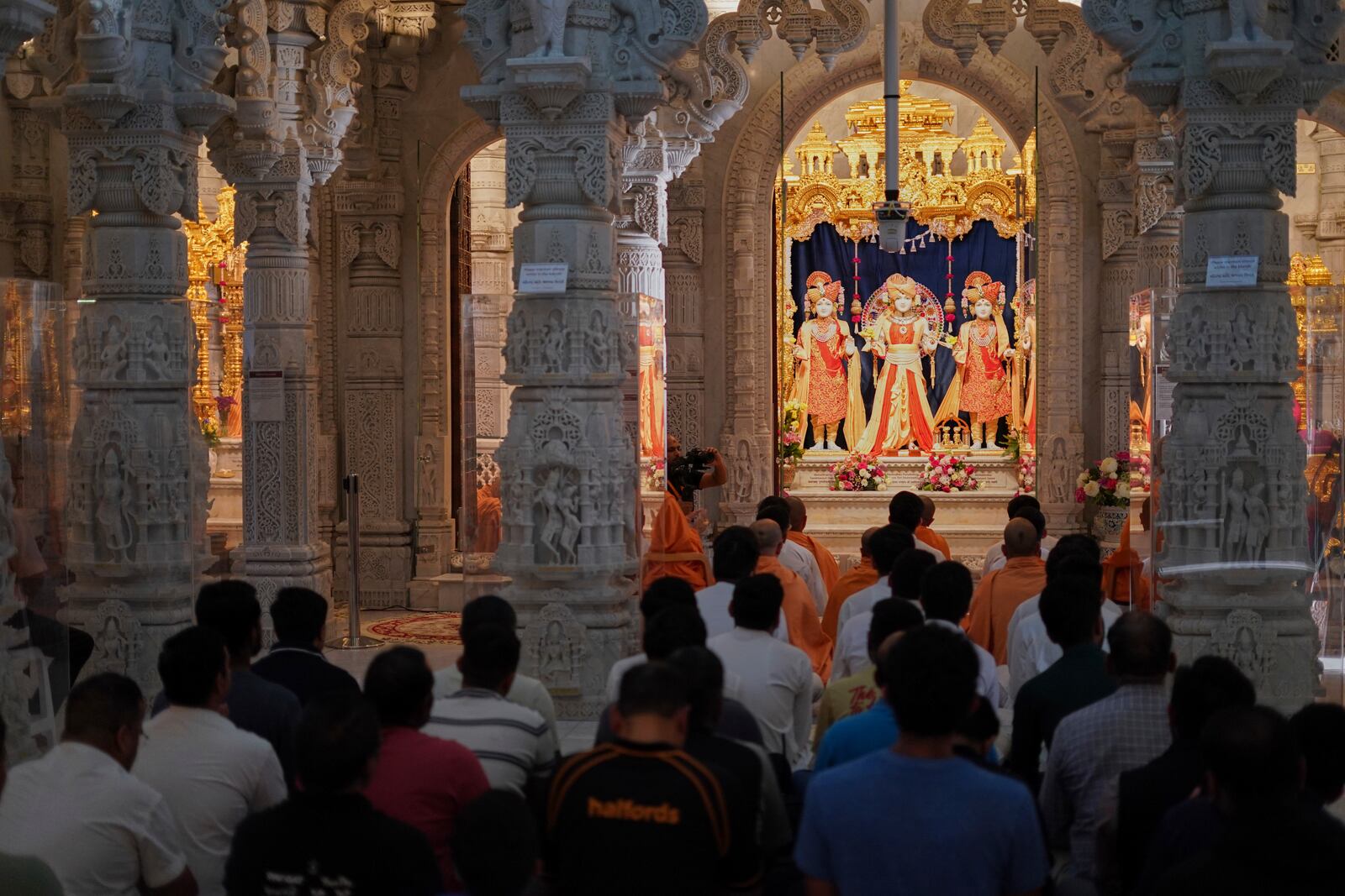 People attend prayers at the BAPS Shri Swaminarayan Mandir, the Hindu Neasden Temple, London, Thursday, June 12, 2025, for the victims of the Air India aircraft crash in Ahmedabad, India. (AP Photo/Alberto Pezzali)