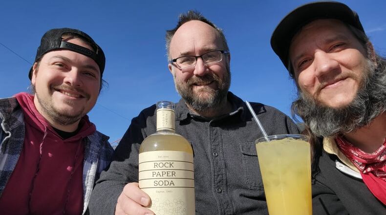 Rock, Paper, Soda is a brand new craft soda brand that will launch tomorrow, Nov. 18 at a pop-up food event at Yellow Cab Tavern from 6 p.m. to 9 p.m. Founders of the new soda brand are James Burton (left), The Pizza Bandit chef and partner, Shane Anderson (middle), Ghostlight Coffee founder and owner, and Brian Johnson (right), The Pizza Bandit partner.