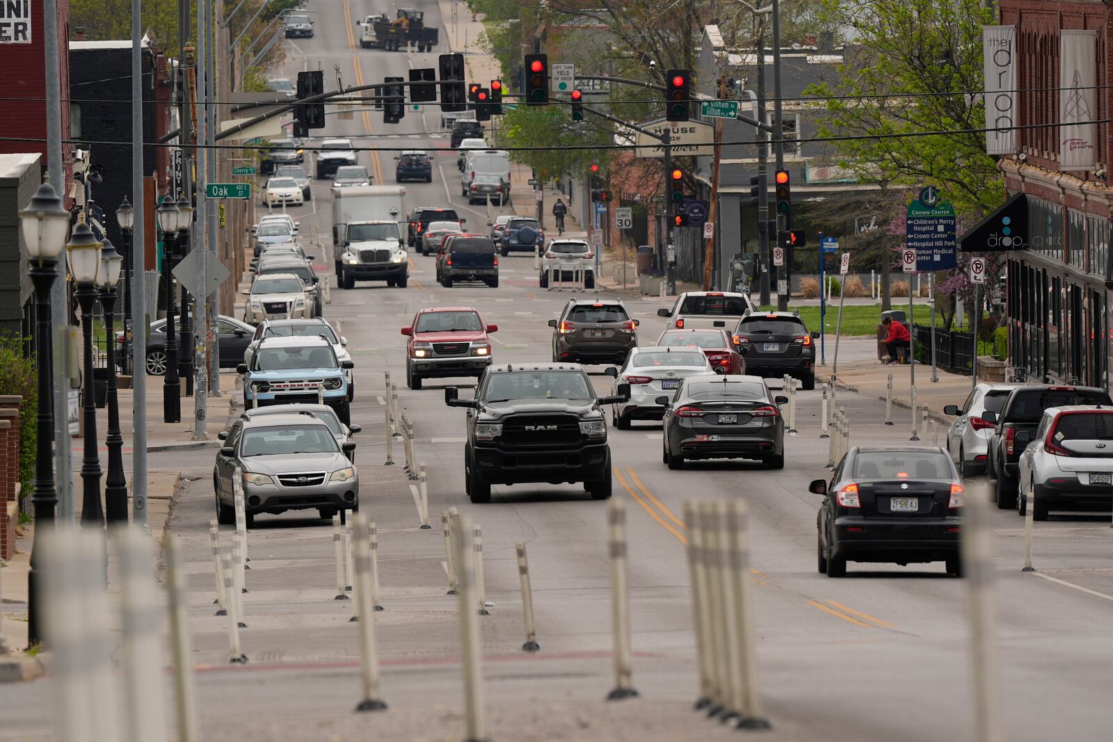 Motorists navigate 31st Street in Kansas City, Mo., where the city implemented a "road diet" reducing the street from four lanes to two in an effort to reduce speeding and accidents, Thursday, April 17, 2025. (AP Photo/Charlie Riedel)