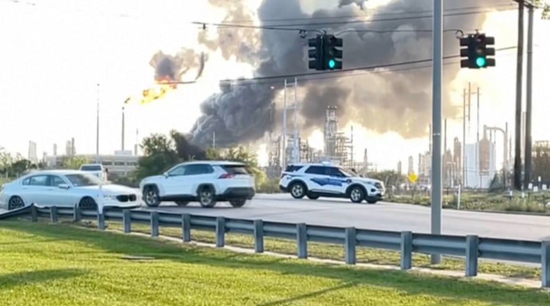 In this still image taken from a video provided by KBMT, smoke rises near the Valero Port Arthur Refinery in Port Arthur, Texas Monday, March 23, 2026. (KBMT via AP)