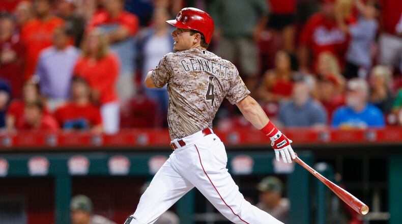 Reds everywhere man Scooter Gennett watches his fourth home run against the Cardinals at Great American Ball Park on June 6.