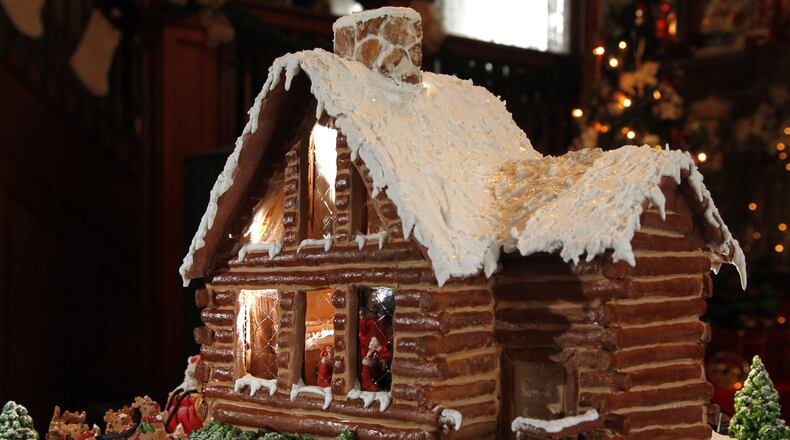 Donna Brinson-Alexander of Brookville is the professional division winner of the 2013 Gingerbread Home for the Holidays contest. She created her home to look like a log cabin. LISA POWELL / STAFF