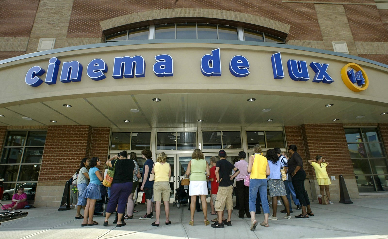 People gather in front of The Greene's new 14-screen movie theater Thursday for free ticket following the grand opening of the new shopping center in Beavercreek. Staff photo by Chris Stewart