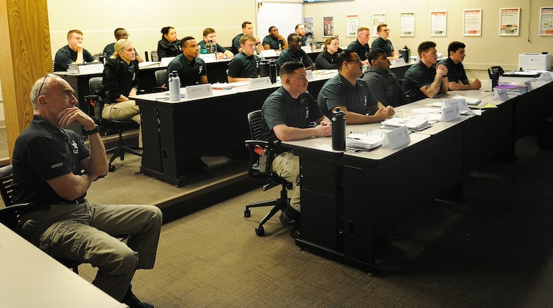 Sinclair police cadets have classroom training Wednesday, Feb. 28, 2024 on how to respond to domestic violence calls. MARSHALL GORBY\STAFF