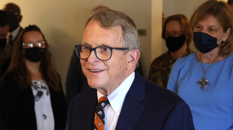 Governor Mike DeWine speaks to members of the media as he tours the vaccination clinic at New Carlisle Senior Living. BILL LACKEY/STAFF