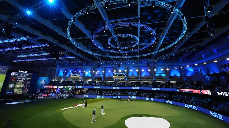 FILE - Fans watch play during a match of the TMRW Golf League (TGL) between Jupiter Links Golf Club and Boston Common Golf, Monday, Jan. 27, 2025, in Palm Beach Gardens, Fla. (AP Photo/Rebecca Blackwell,File)