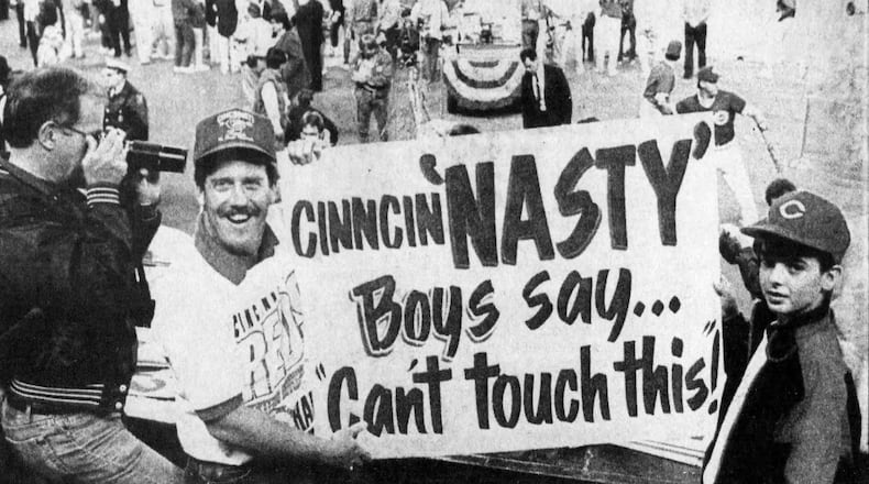 Marty Prather, of Bellbrook, was considered a Reds superfan. He was known for bring large, clever and professionally painted signs to the ballpark. Game 2 of the 1990 World Series was no exception. DAYTON DAILY NEWS ARCHIVES