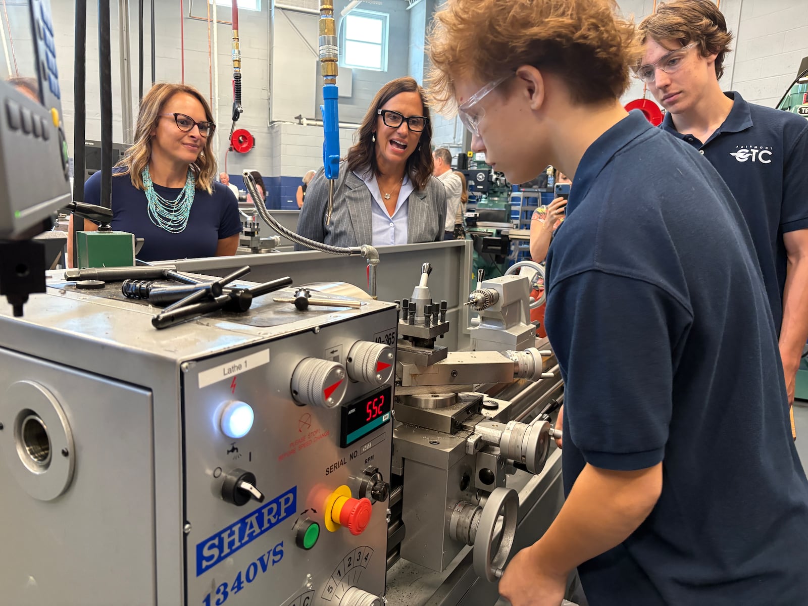 Isaiah Baird, a senior, uses a lathe, a machine tool used to shape metal, during a demonstration Thursday, Aug. 7, 2025, at the grand opening celebration of the new advanced manufacturing program and revamped engineering space at Kettering Fairmont High School's Career Technology Center. JEN BALDUF/STAFF