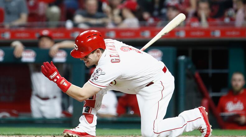 CINCINNATI, OH - APRIL 13: Scooter Gennett #3 of the Cincinnati Reds swings and misses at a pitch in the eighth inning against the St. Louis Cardinals at Great American Ball Park on April 13, 2018 in Cincinnati, Ohio. (Photo by Andy Lyons/Getty Images)