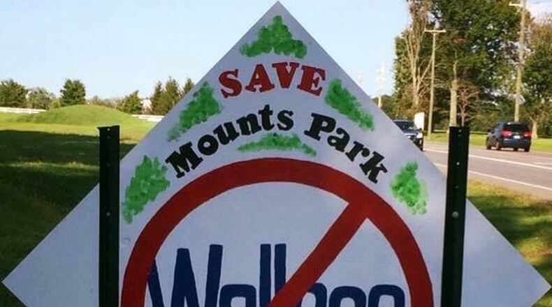 Lisa Wilson and Katy Wuest, two of the residents suing Hamilton Twp. Trustee David Wallace Jr., use an anti-Wallace sign as their Facebook profile photo.