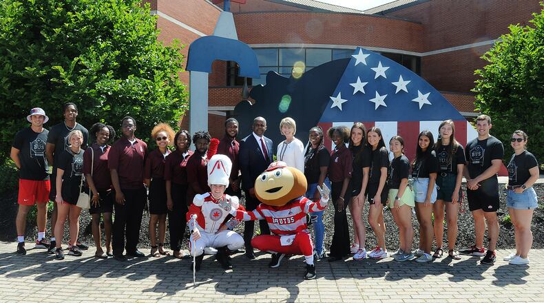 Central State University President, Jack Thomas and the Ohio State University Prsident, Kristina M. Johnson pose with students from both universities in front of the C. J. McLin International Center for Water Resources Management at Central State University, Tuesday June 28, 2022. MARSHALL GORBY\STAFF