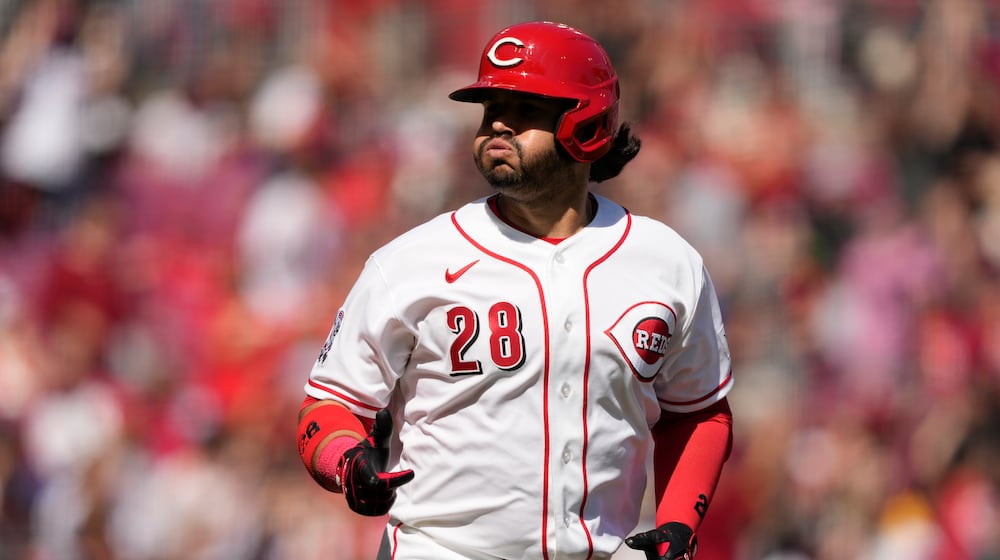 Cincinnati Reds' Eugenio Suárez reacts as he rounds the bases after hitting a three-run homer during the sixth inning of a baseball game against the Boston Red Sox in Cincinnati, Sunday, March 29, 2026. (AP Photo/Carolyn Kaster)