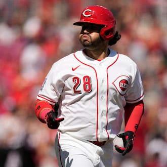 Cincinnati Reds' Eugenio Suárez reacts as he rounds the bases after hitting a three-run homer during the sixth inning of a baseball game against the Boston Red Sox in Cincinnati, Sunday, March 29, 2026. (AP Photo/Carolyn Kaster)