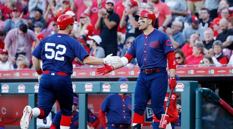 CINCINNATI, OH - MAY 05: Joey Votto #19 of the Cincinnati Reds congratulates Kyle Farmer #52 after he hit a solo home run in the ninth inning against the San Francisco Giants at Great American Ball Park on May 5, 2019 in Cincinnati, Ohio. The Giants won 6-5. (Photo by Joe Robbins/Getty Images)