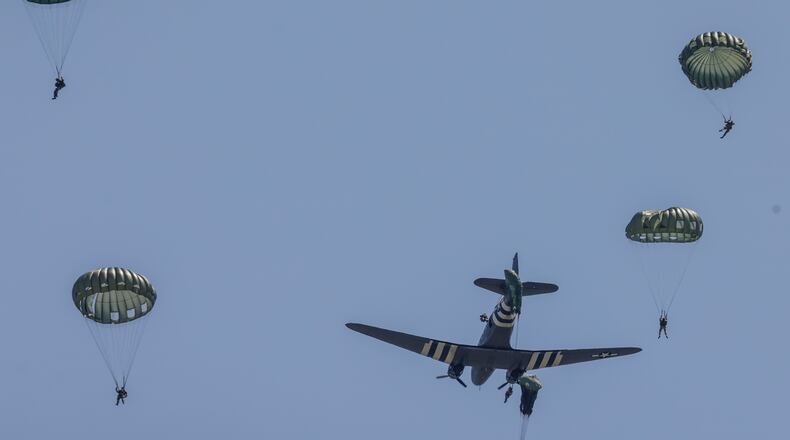 Two WWII C-47 aircraft and around 30 paratroopers visited the National Museum of the United States Air Force Wednesday April 27, 2022. After landing, the public was permitted to check out the historic aircraft close-up. JIM NOELKER/STAFF