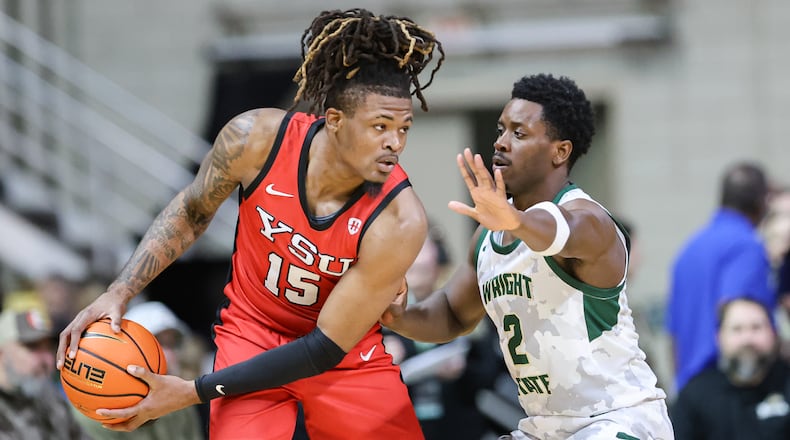 Wright State guard Sam Alamutu guards Youngstown State's Cris Carroll during a Horizon League game on Thursday, Jan. 15 at Ervin J. Nutter Center in Fairborn. BRYANT BILLING/STAFF
