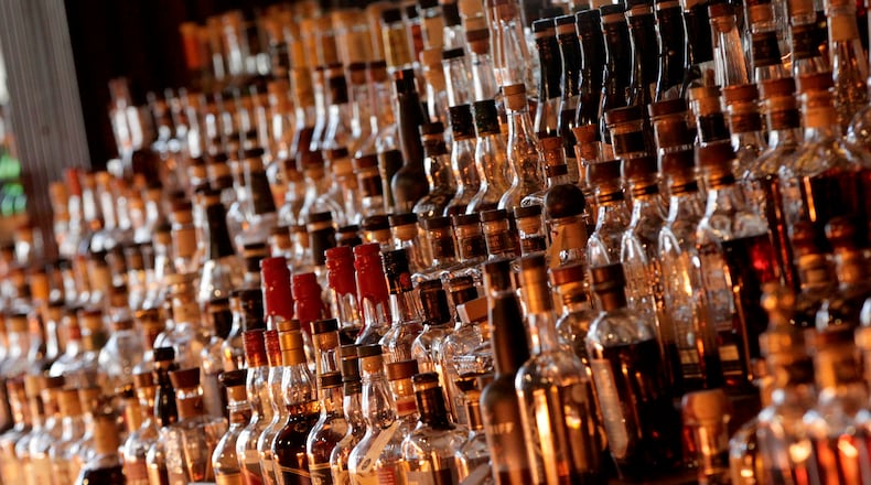 Daytonâs Century Bar has reopened in the three-story former Dayton Power and Light building, 18 S. Jefferson St. The historic cherry wood bar, the centerpiece of the original Century Bar, has been restored and installed in the new expanded space. Century Bar is co-owned by Diane Spitzig and Joseph Head. LISA POWELL / STAFF