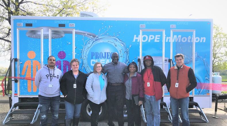Miami Valley Housing Opportunities (MVHO) staff pictured at the launch of a recent homeless outreach program, Project Clean. CONTRIBUTED